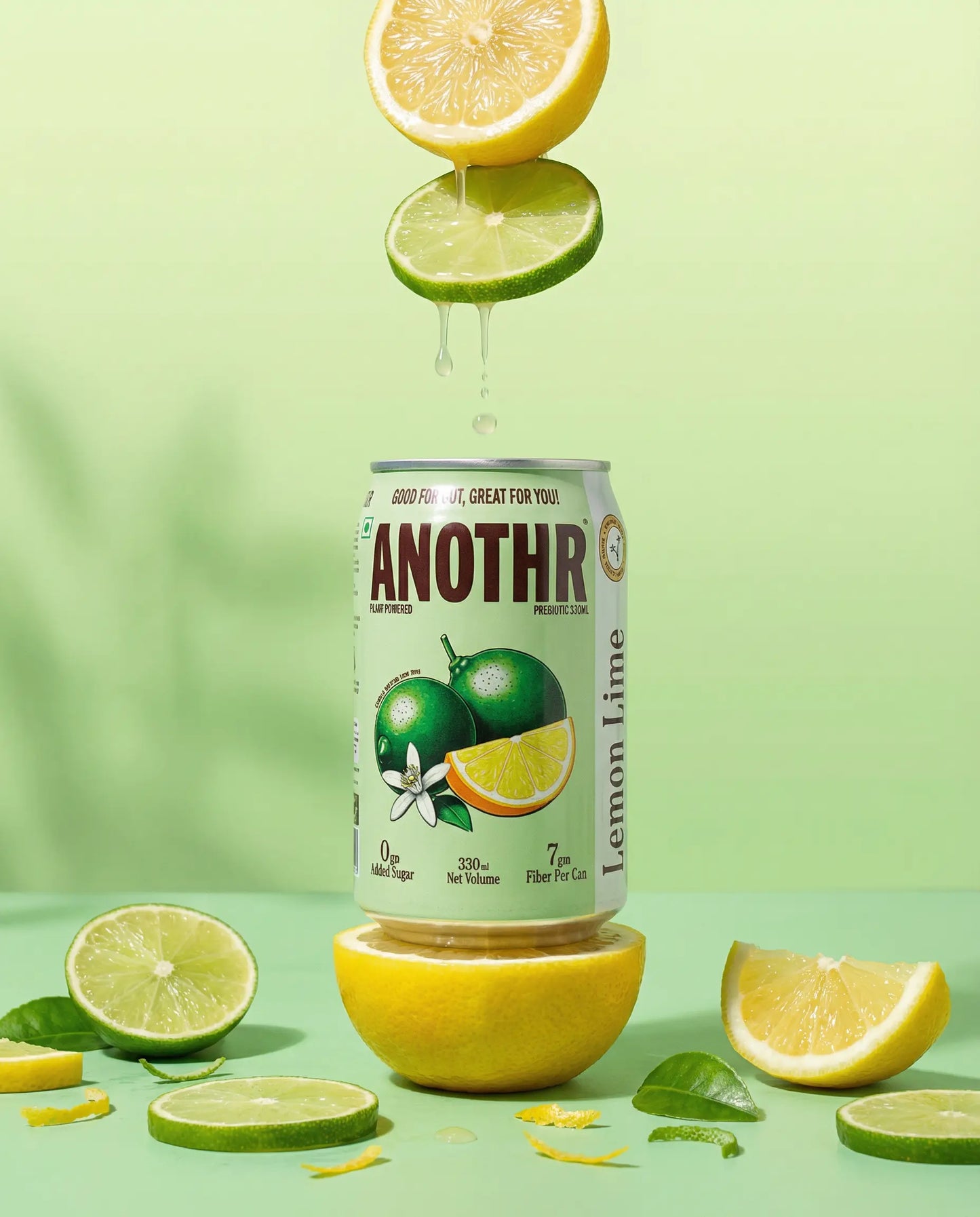 Green can of 'ANOTHR Prebiotic Cold Drink' Lemon Lime flavor on a Green plain background. 