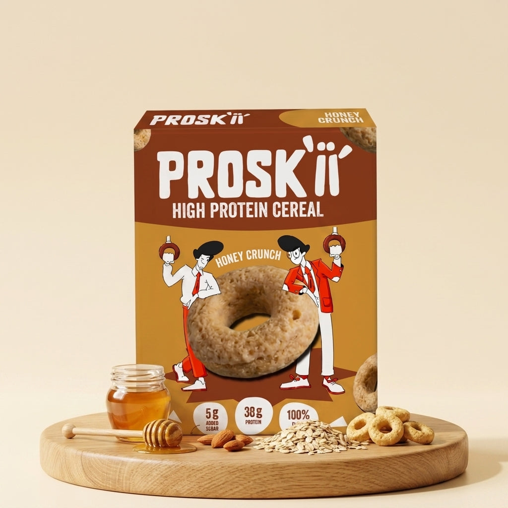 A box of PROSKii High Protein Cereal, Honey Crunch flavor, displayed on a wooden tray with honey, oats, and cereal pieces against a solid beige background.